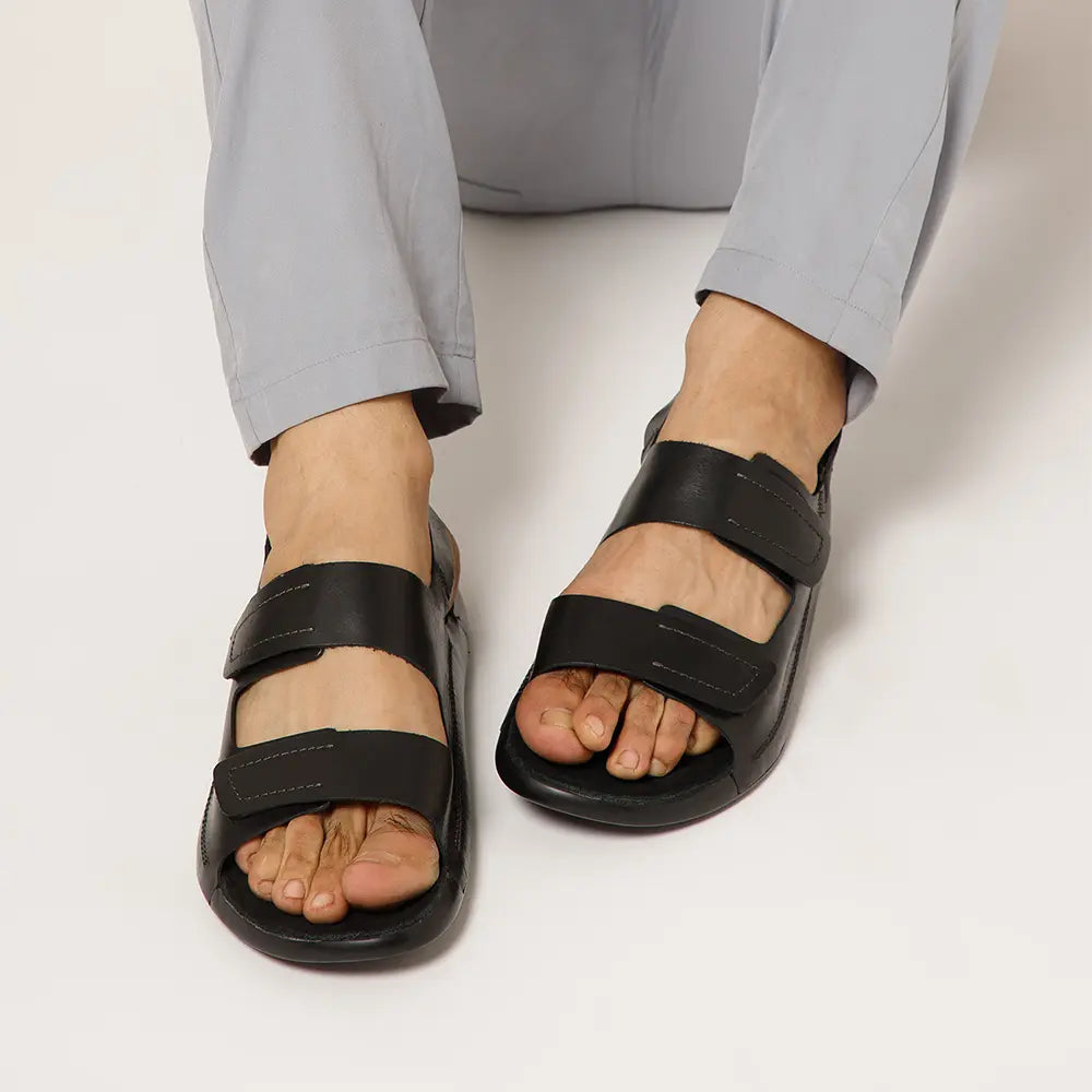 Close-up of the smooth Premium leather upper on the black men's sandals.