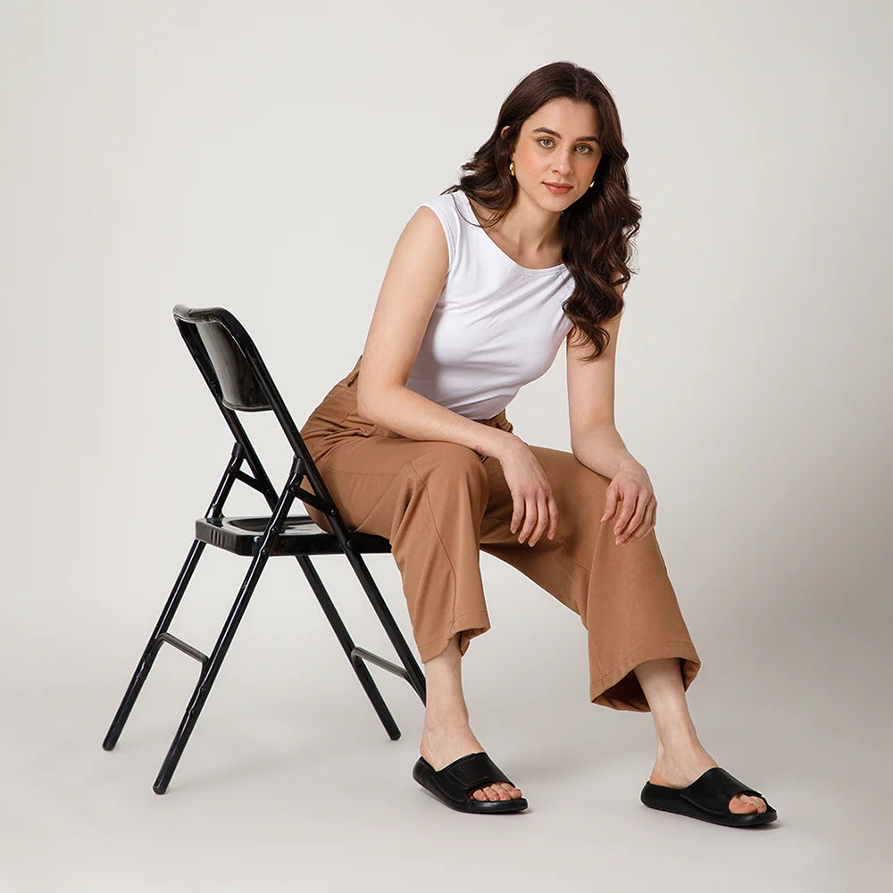 Stylish NoStrain flat leather sliders in black with BIS certified straps and lightweight PU grip.