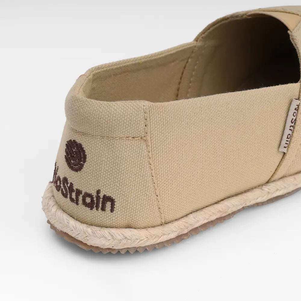 NoStrain brand beige slip-on shoes for women suitable for both casual and formal settings.