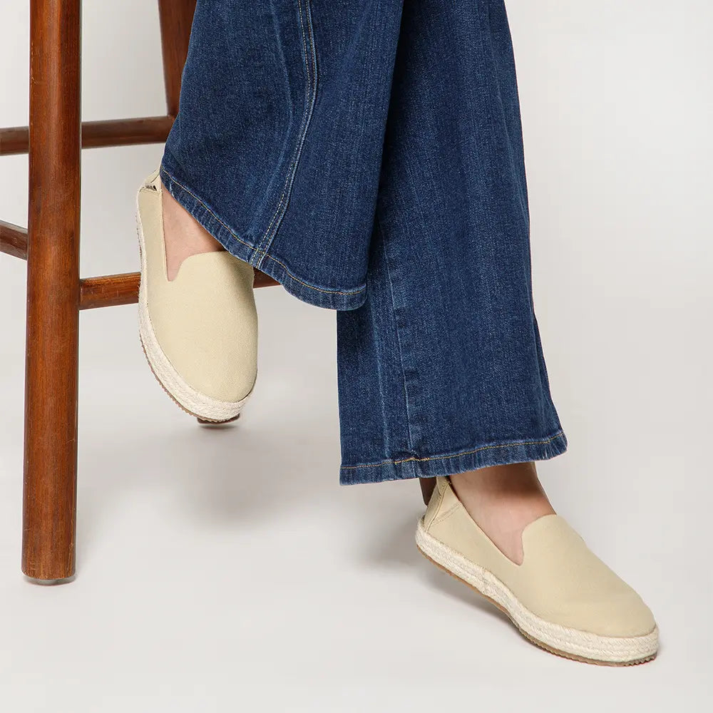 NoStrain brand beige slip-on flats for women with a durable Ortholite removable insole.