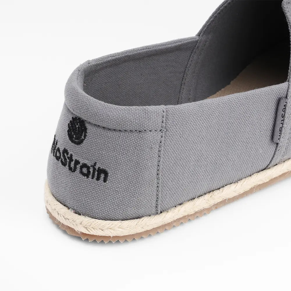 Durable grey cotton shoes for men by NoStrain showing the rubberized anti-skid outsole for better grip.