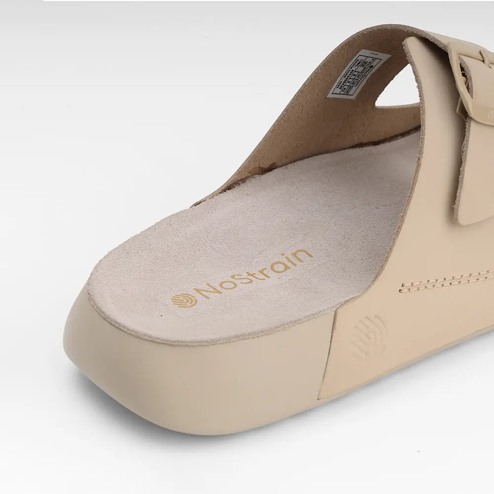 Premium beige leather sandals by NoStrain featuring adjustable buckles and comfortable PU soles.