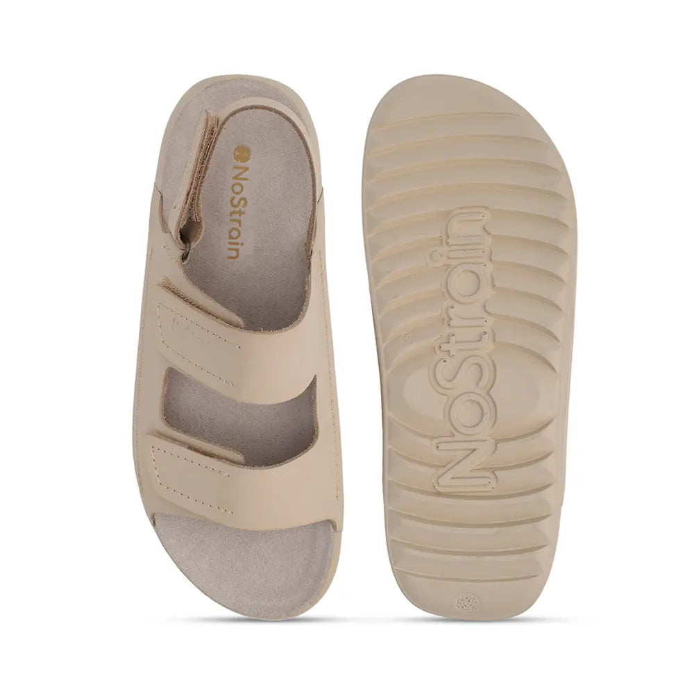 Comfortable beige leather sandals for women by NoStrain featuring a durable PU sole for all-day wear.