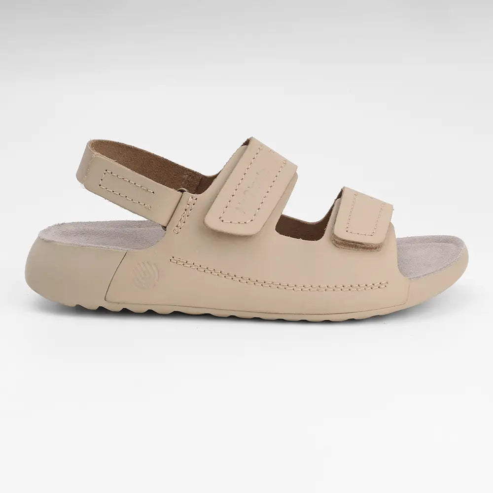 Comfortable beige leather sandals for women by NoStrain featuring a durable PU sole for all-day wear.