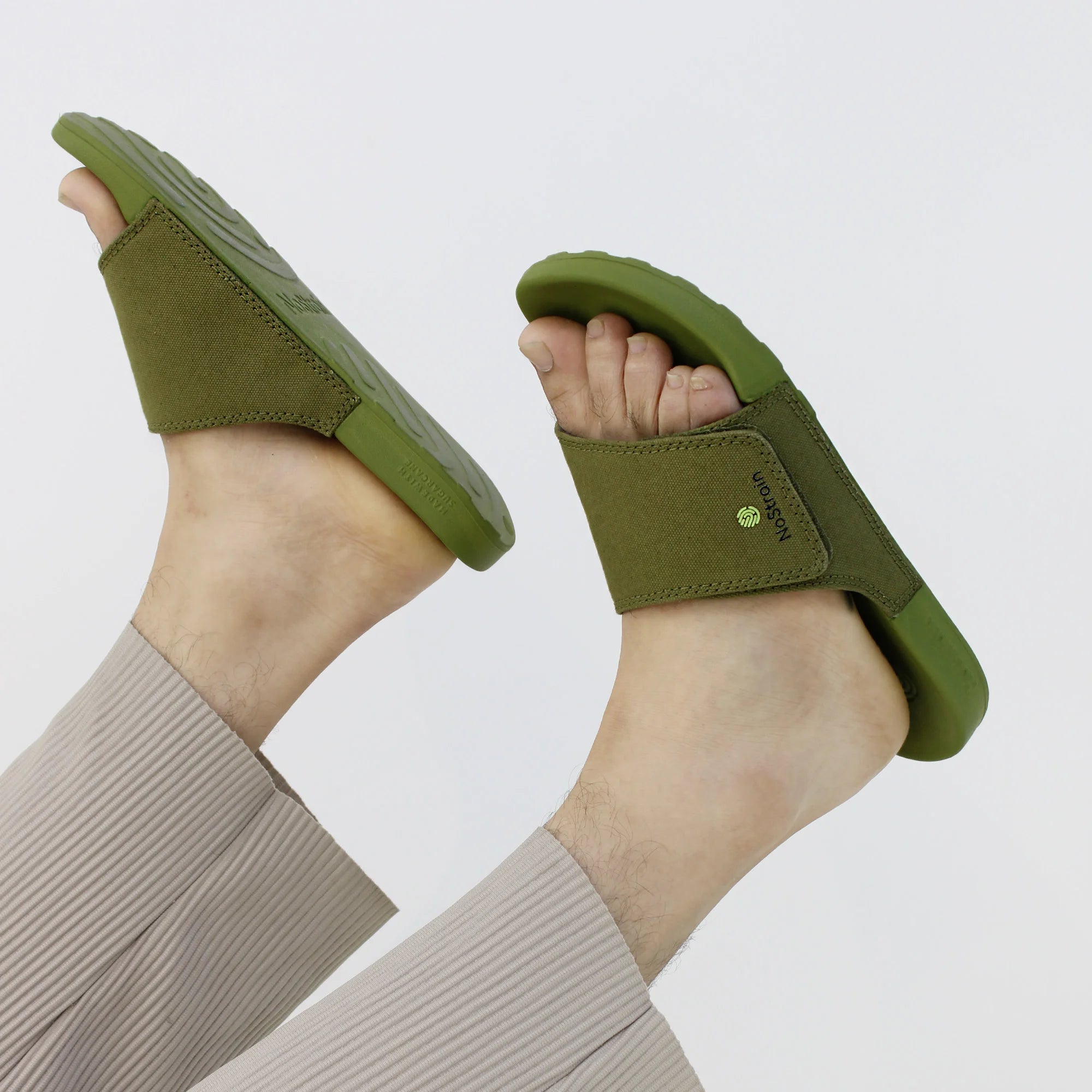 Olive green canvas Men's Sugar Sliders with a comfortable, slip-on design.