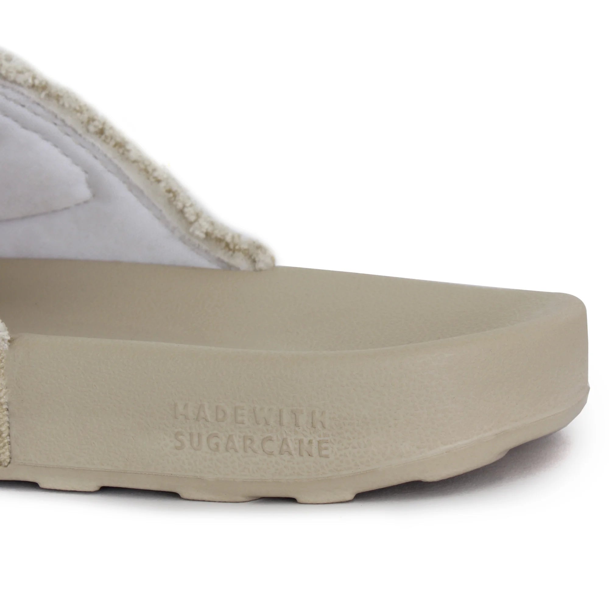 Sandy beige Men's Sliders featuring a unique sugar-shaped sole with added traction and rough edges for a touch of attitude.