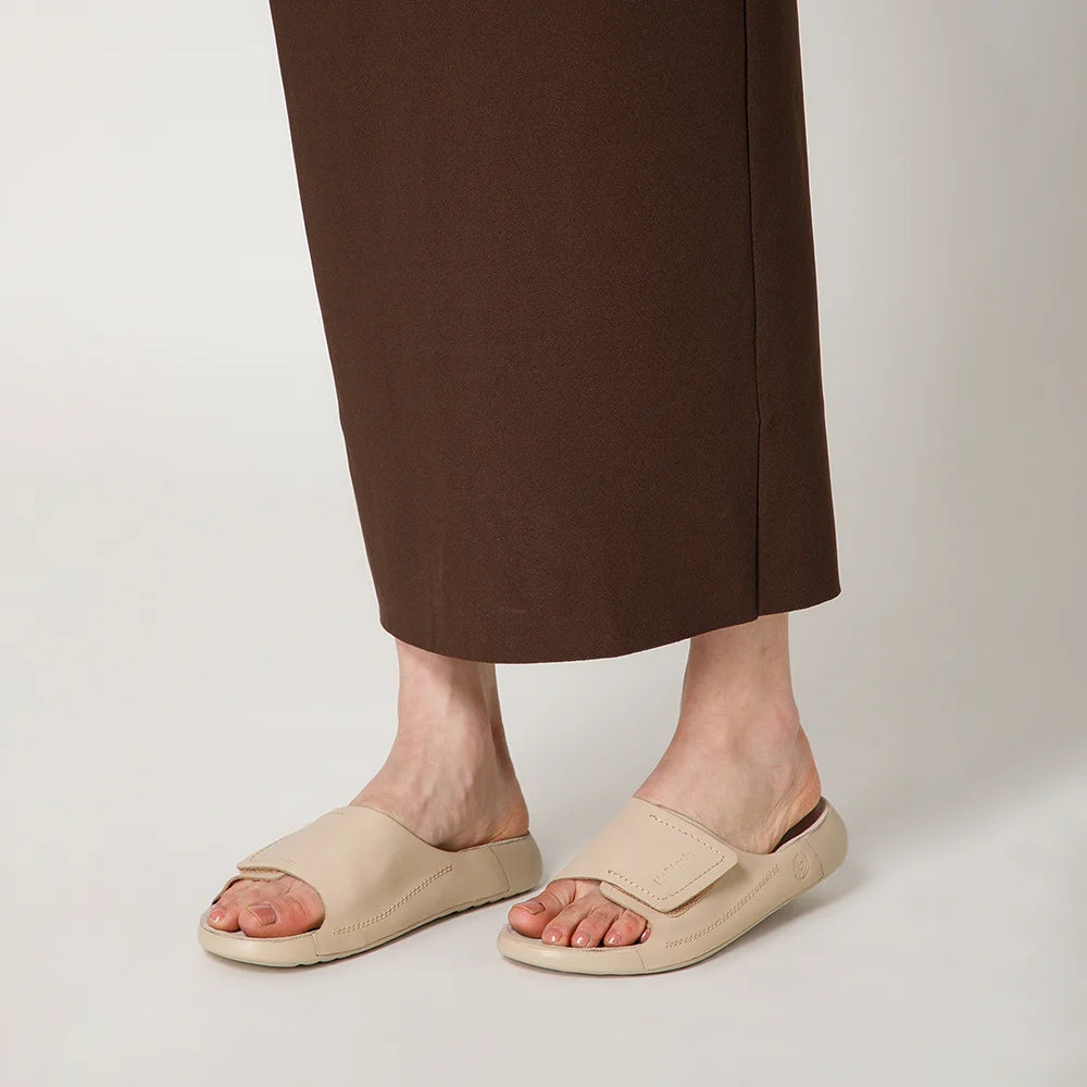 Premium NoStrain beige leather footwear for women with adjustable broad straps and durable outsole.