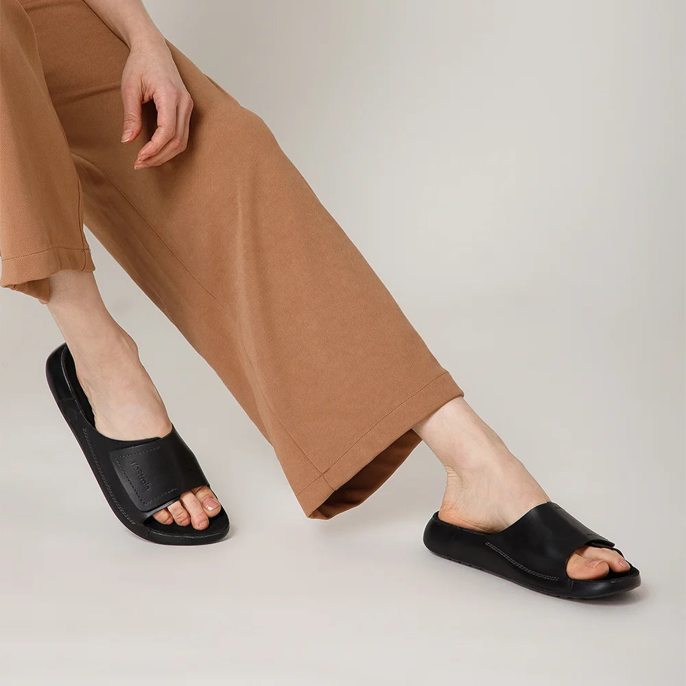 Comfortable NoStrain ladies leather slides featuring BIS certified hook loop closure and PU sole.