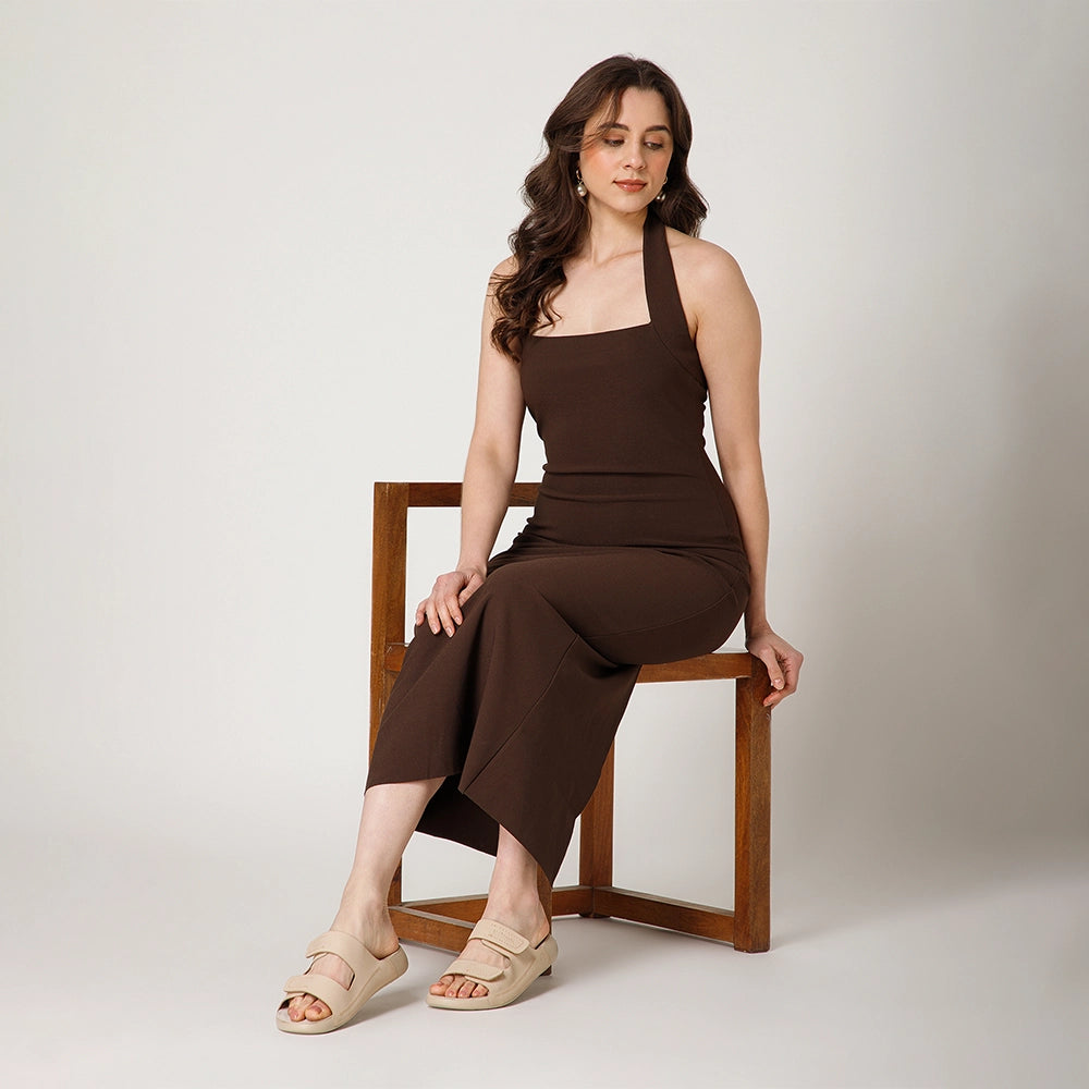 Durable NoStrain beige leather flat sandals for women with adjustable straps and lightweight outsole.