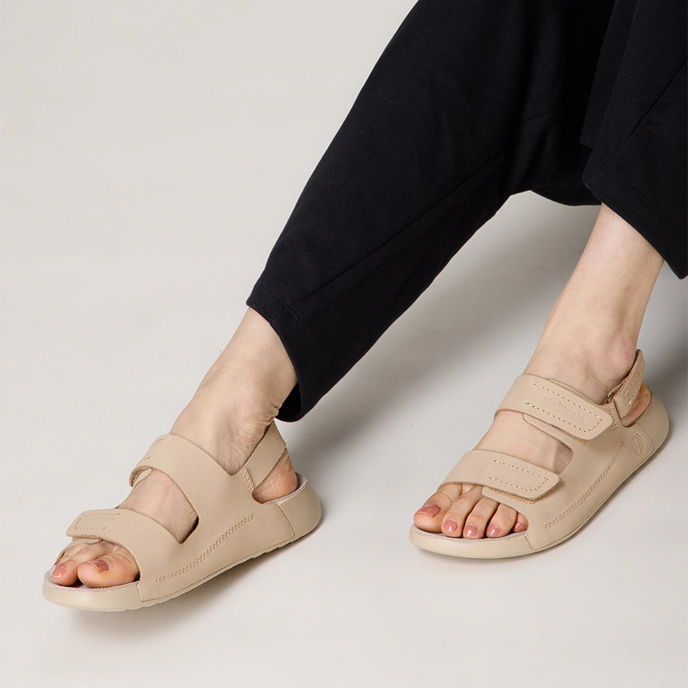 NoStrain designer beige leather footwear for women with lightweight PU outsole and secure closures.