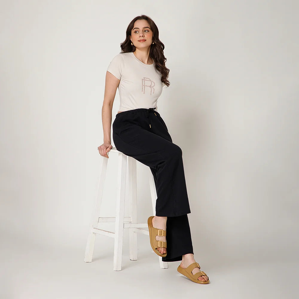 Stylish NoStrain flat camel leather sandals featuring front buckle straps and high quality finish.