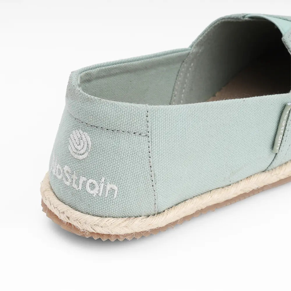 NoStrain women's sage green canvas flats showing the removable cushioned footbed for extra support.