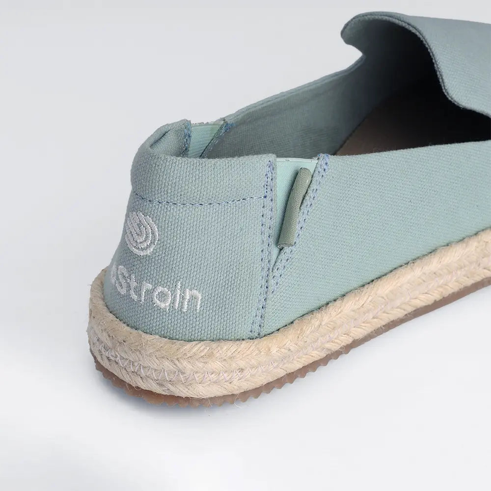 Lightweight sage green canvas slip-on shoes with elastic fit