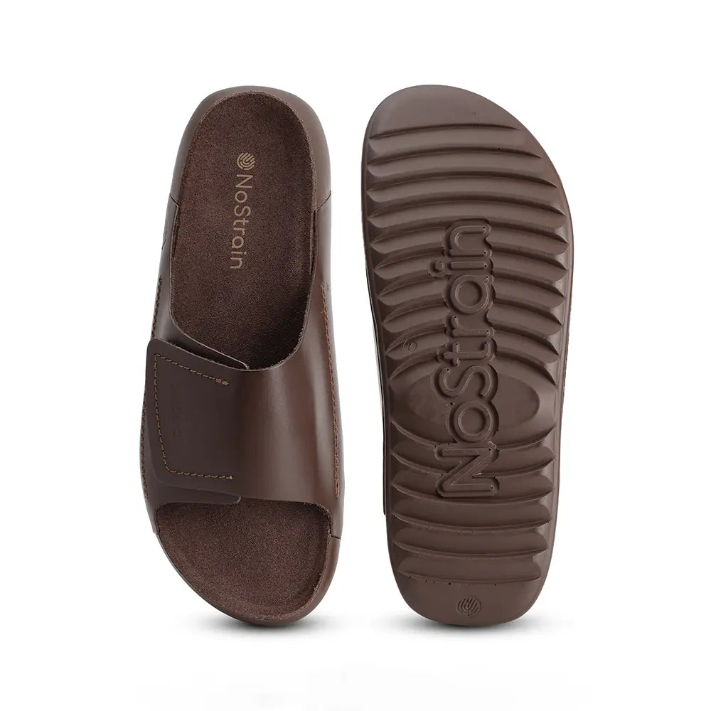 Detailed view of the broad strap design on the adjustable brown Indian Footwear sliders