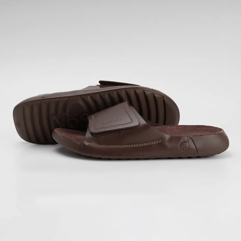 Brown leather sliders for women featuring a broad adjustable strap for Effortless Style.