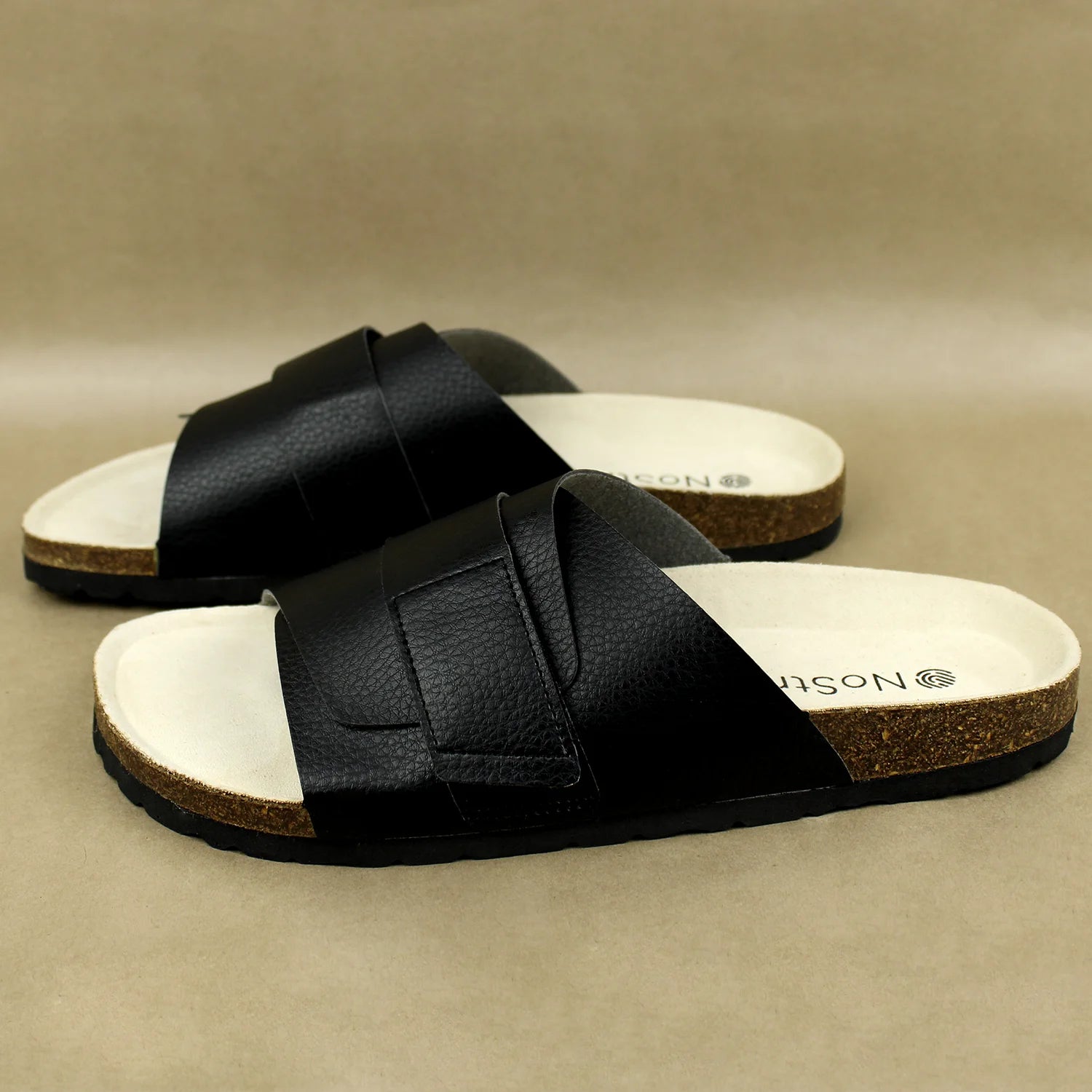 Elegant black cork sandals with adjustable straps, suitable for all-day comfort