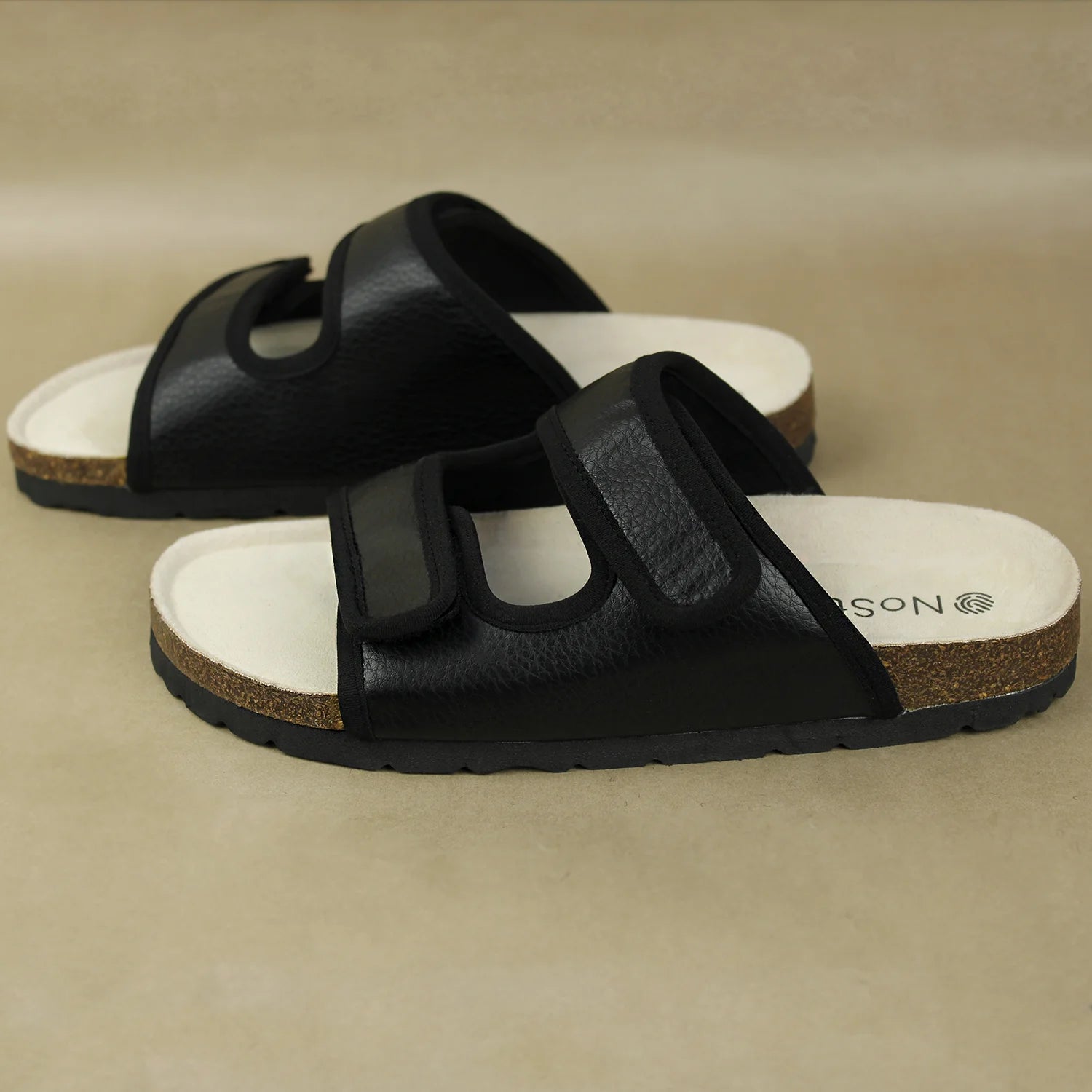 Stylish black cork sandals with natural cork footbed