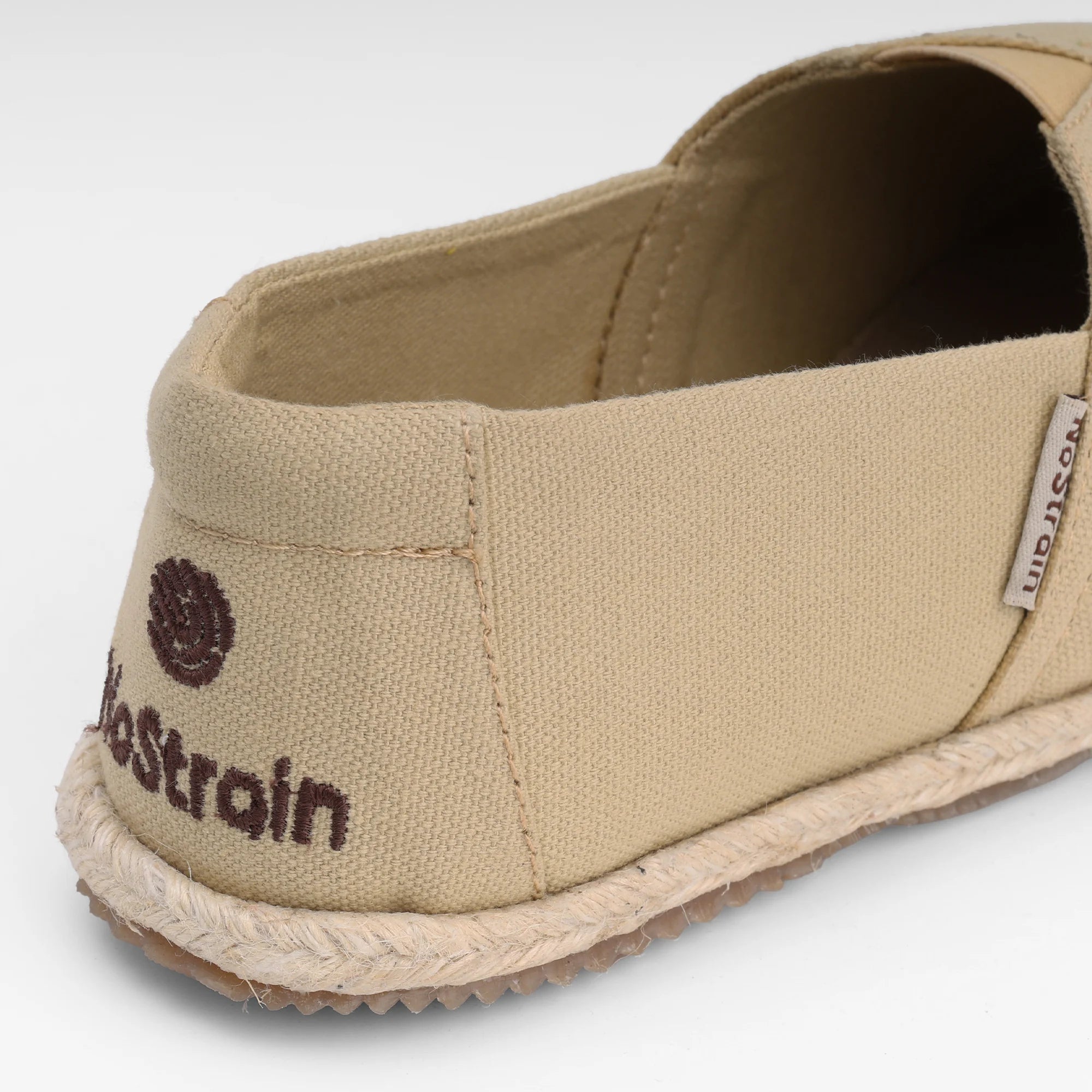 NoStrain brand beige espadrilles for men showing the high quality removable cushioned insole for all-day wear.