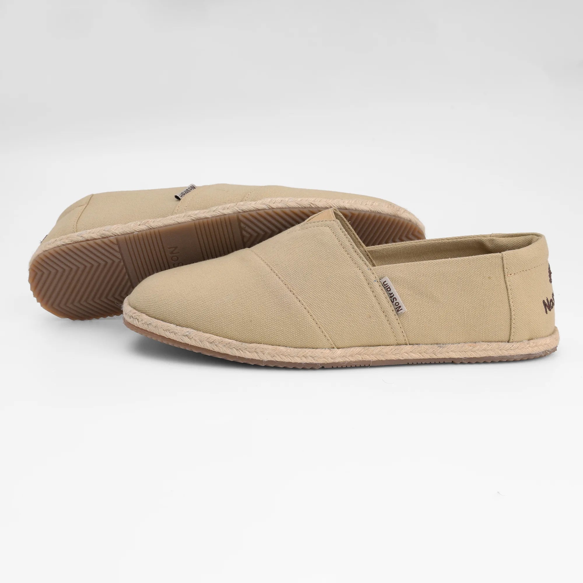NoStrain beige cotton canvas espadrilles for men featuring a breathable upper and lightweight design for summer comfort.