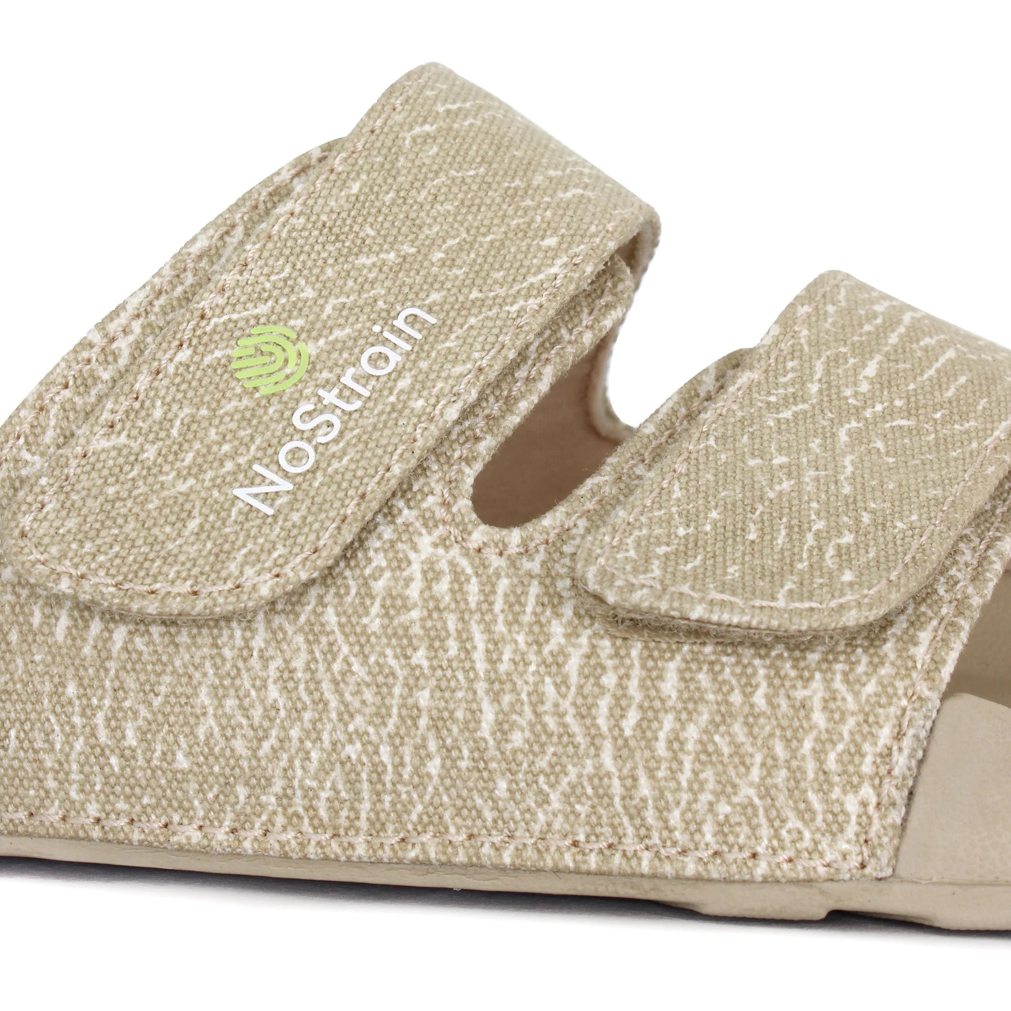 close up view of straps of men’s sandy beige sliders with wave print.